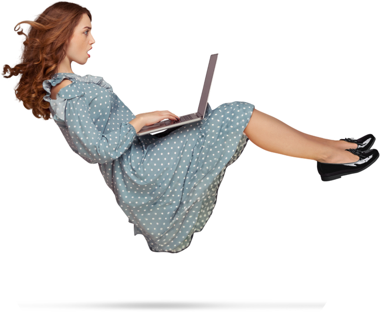 An amazed teacher on her laptop appears to levitate