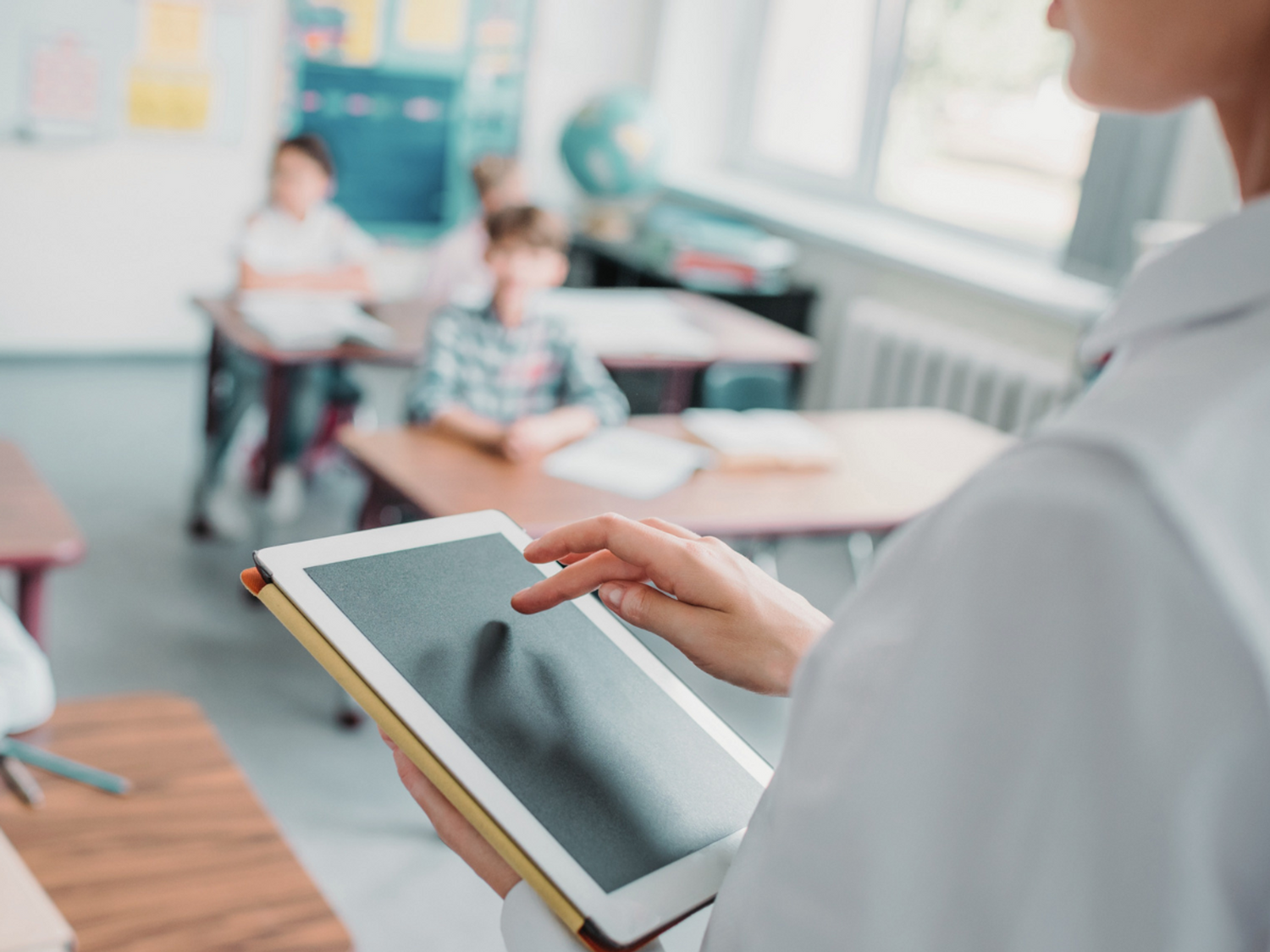 Teacher using technology in the classroom