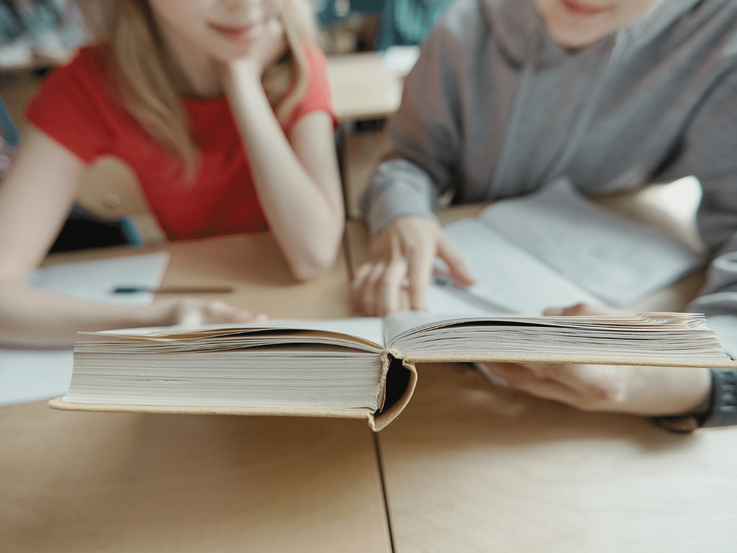 A parent and child reading together to improve literacy skills.